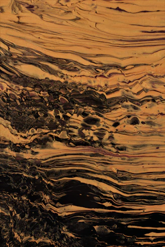 a close up of a brown and black marble