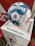 A soccer ball with the text DERBYSTAR and BUNDESLIGA is placed on a white pedestal that also has the BUNDESLIGA logo. The ball features a distinctive blue, white, and red pattern, with handwritten text noting the date 15.12.2021 with a mention of a match involving 1. FC Union Berlin and SC Freiburg.