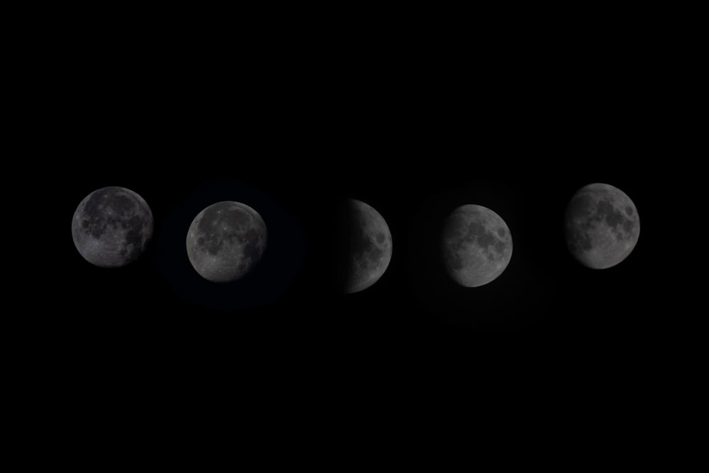 five phases of the moon in the dark sky