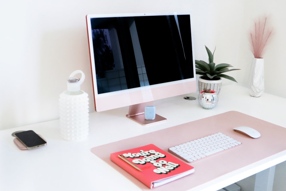 a desktop computer sitting on top of a white desk