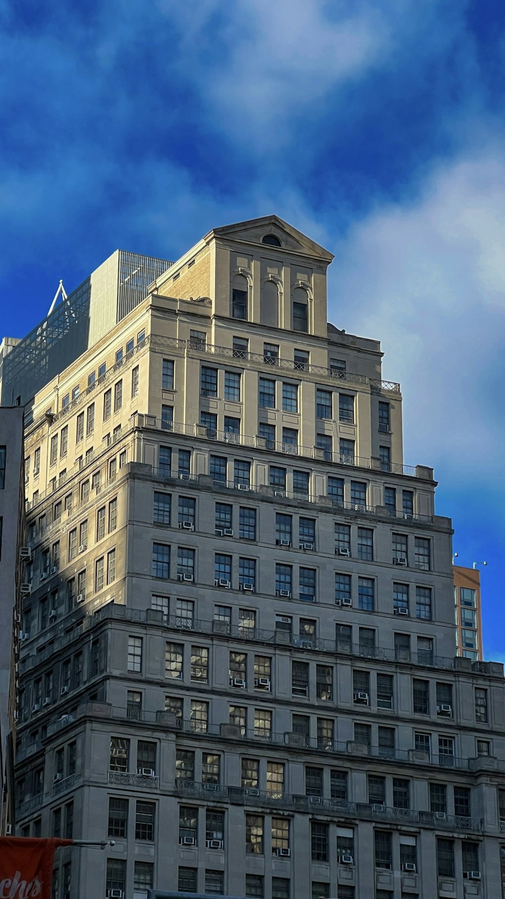 a tall building with a clock on the top of it