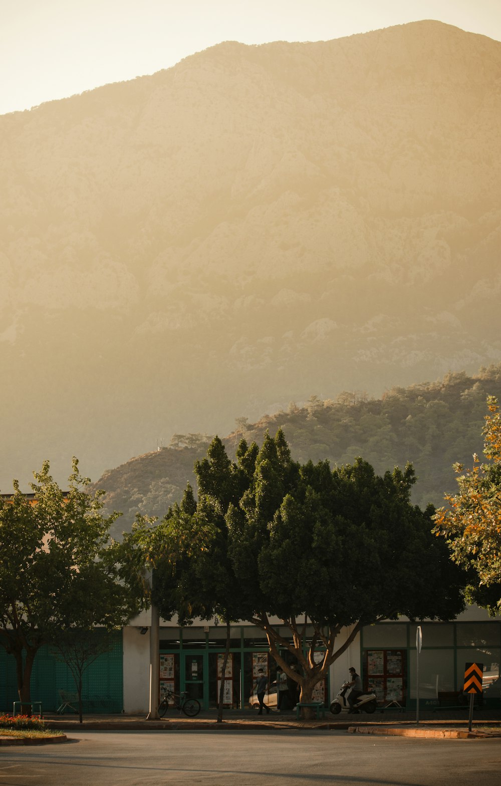 a parking lot with a mountain in the background