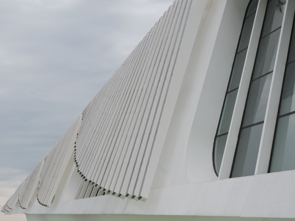 a large white building with a clock on it's side