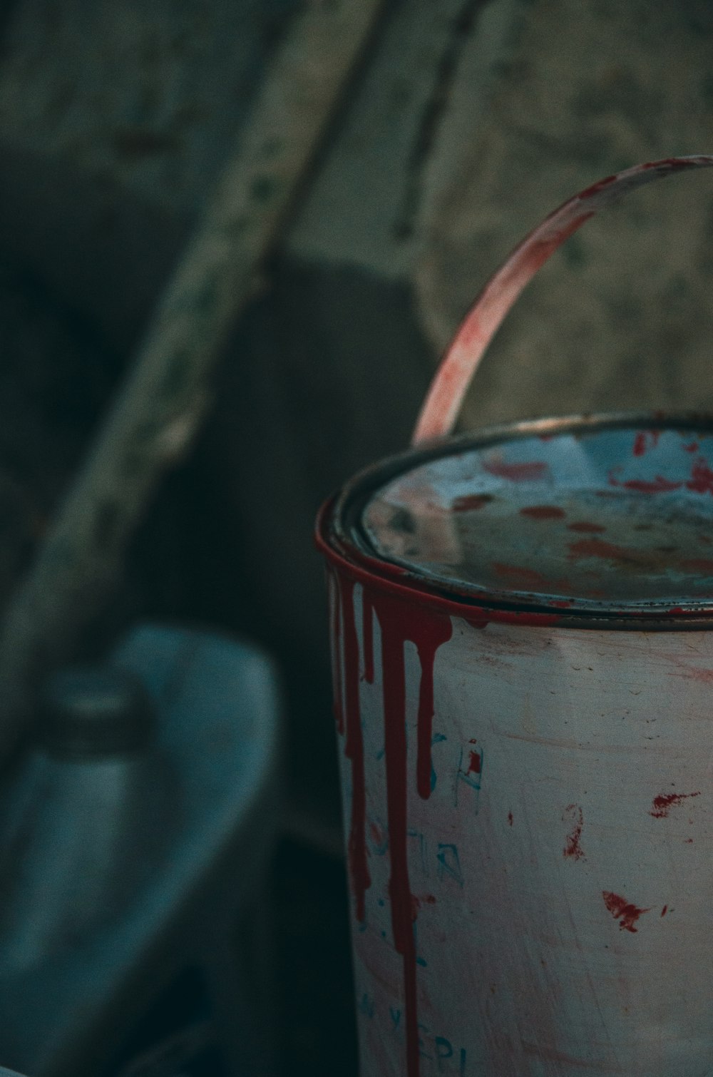 a red and white bucket with a red handle