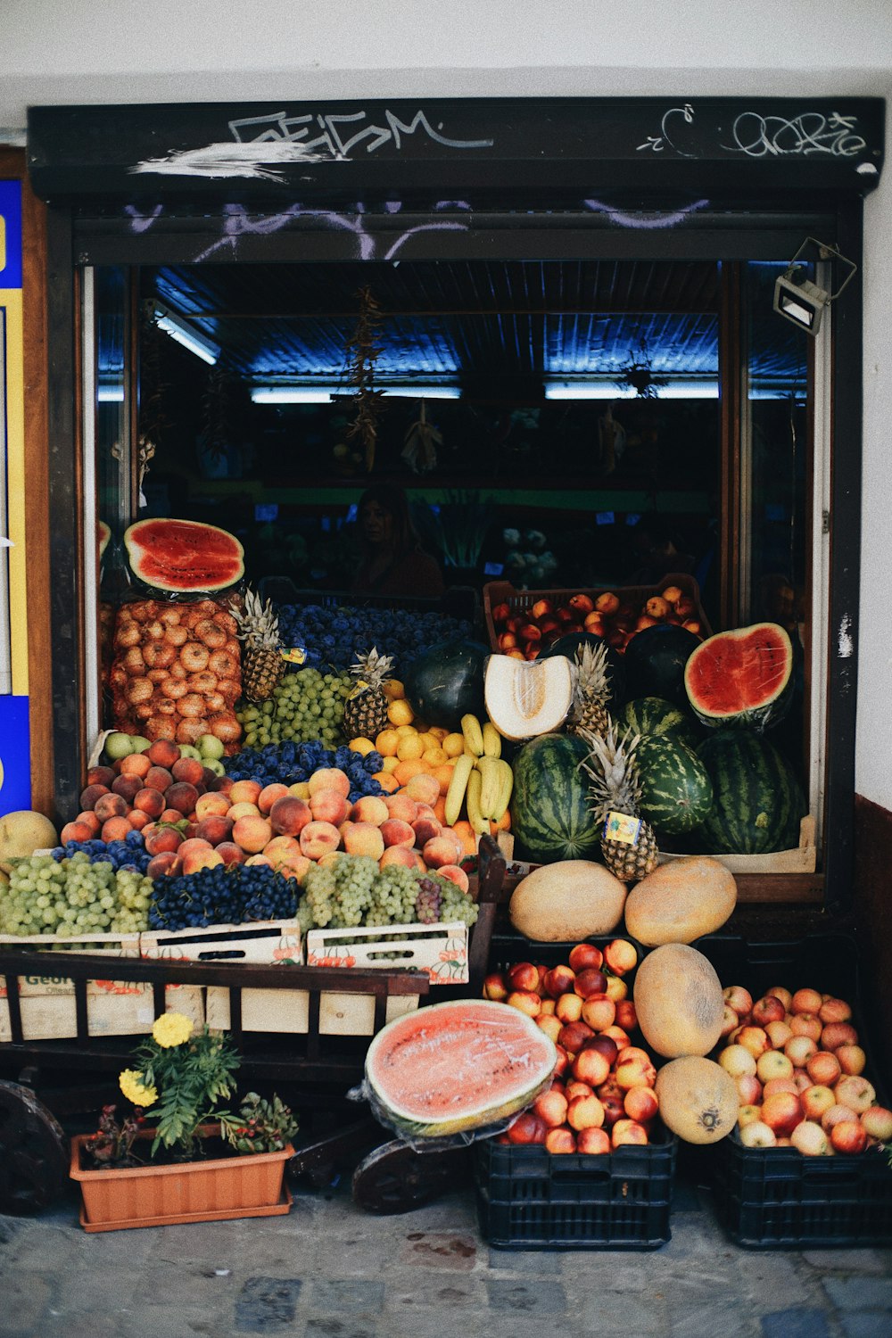 a fruit stand with a variety of fruits and vegetables