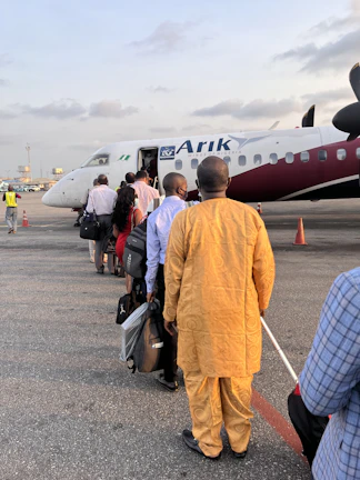 Corporate team members checking in at the airline counter, ready for their group trip.
