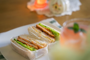 a couple of sandwiches sitting on top of a white plate