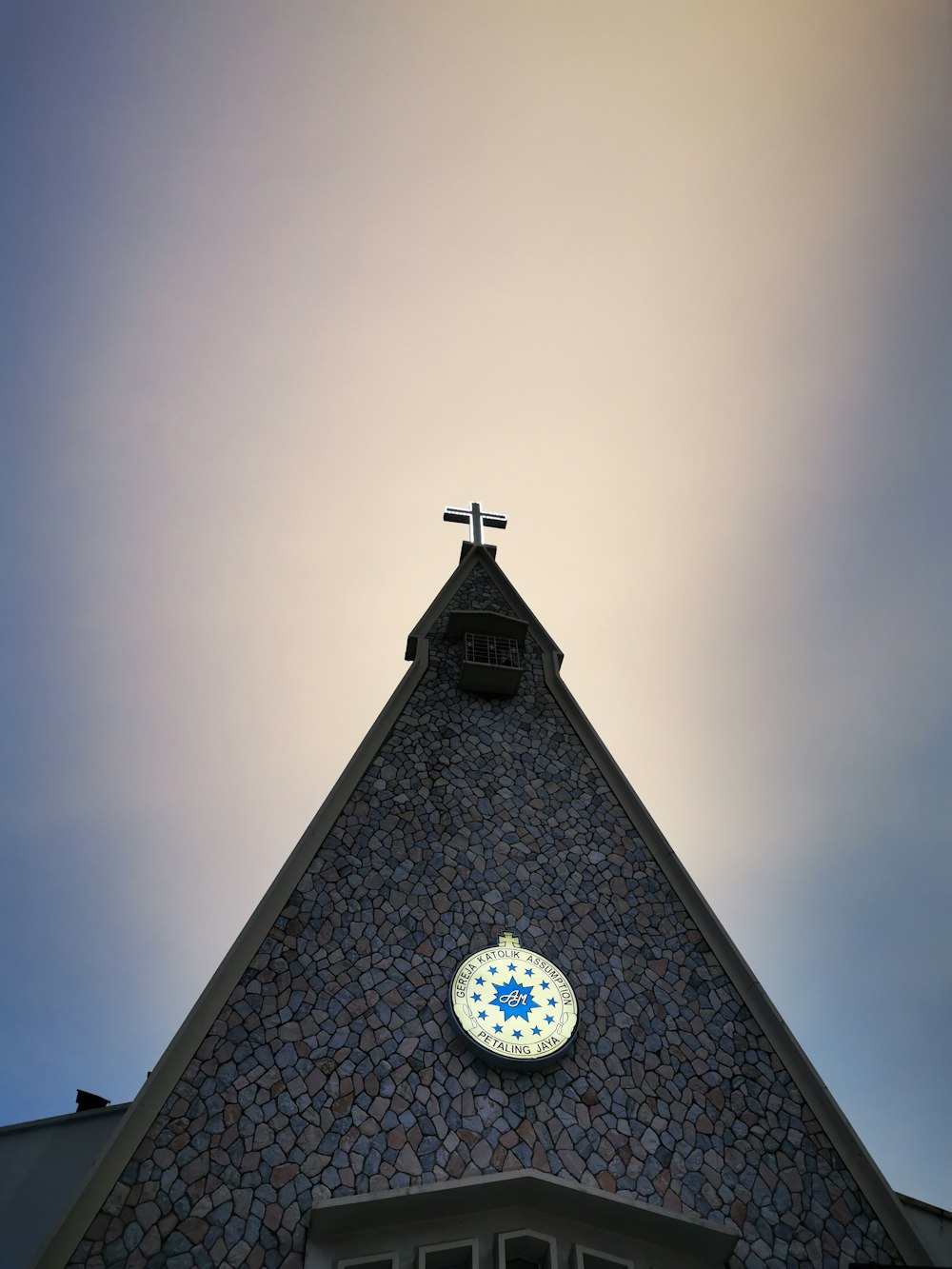 a church steeple with a cross on top