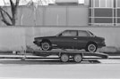 a car is being towed on a flatbed trailer
