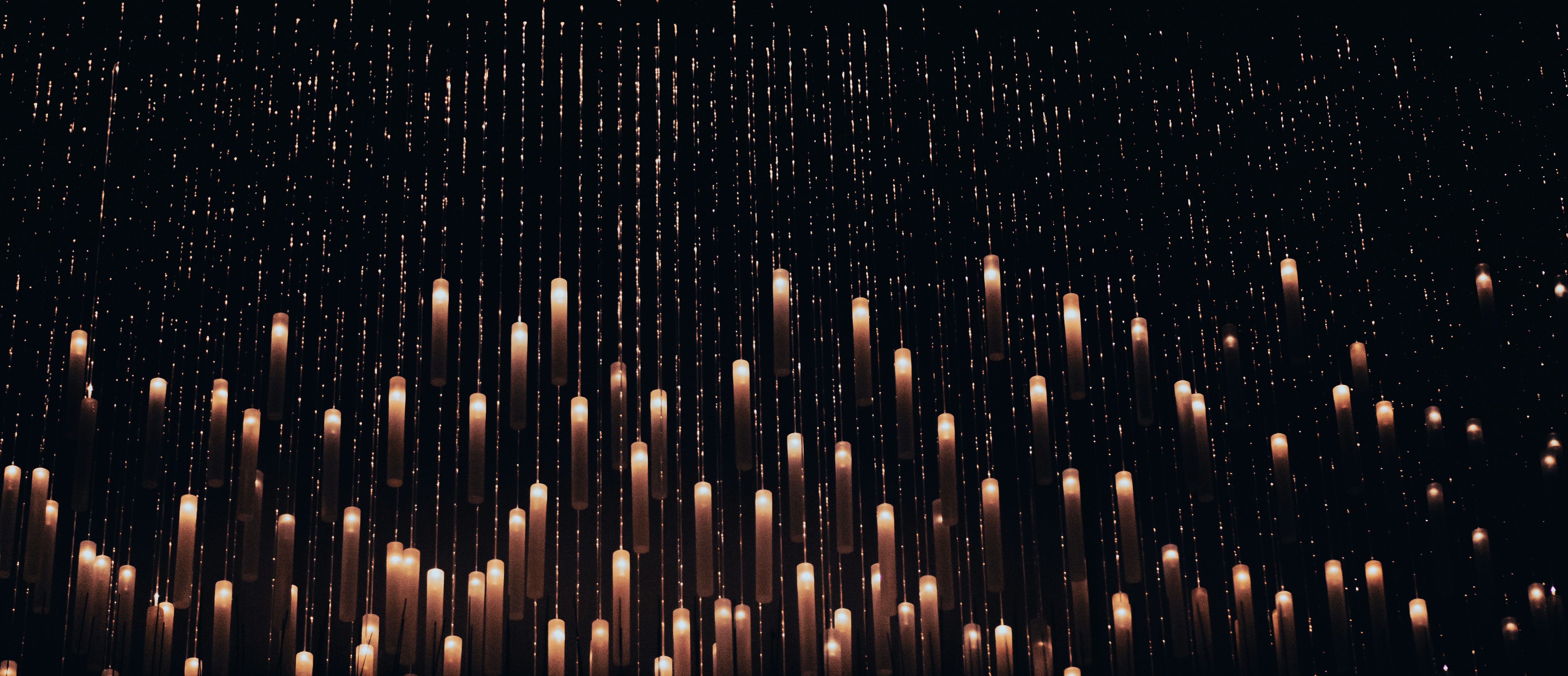 a group of candles that are in the air