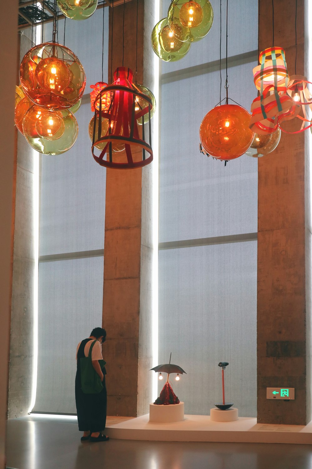 a woman standing in front of a bunch of lights