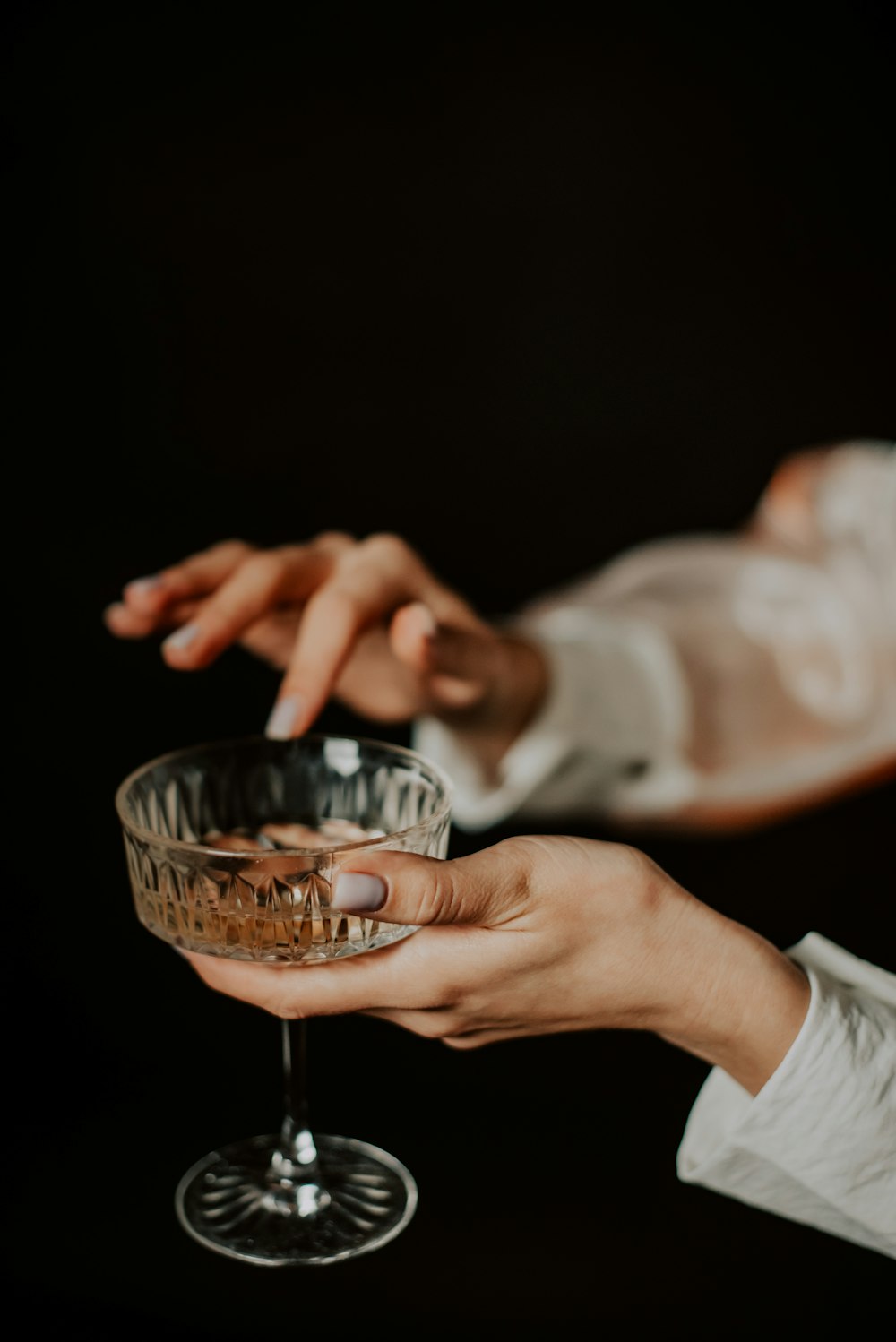 a person holding a wine glass