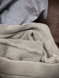 Close-up of diverse textile fabrics showcasing textures from cotton to luxury materials.