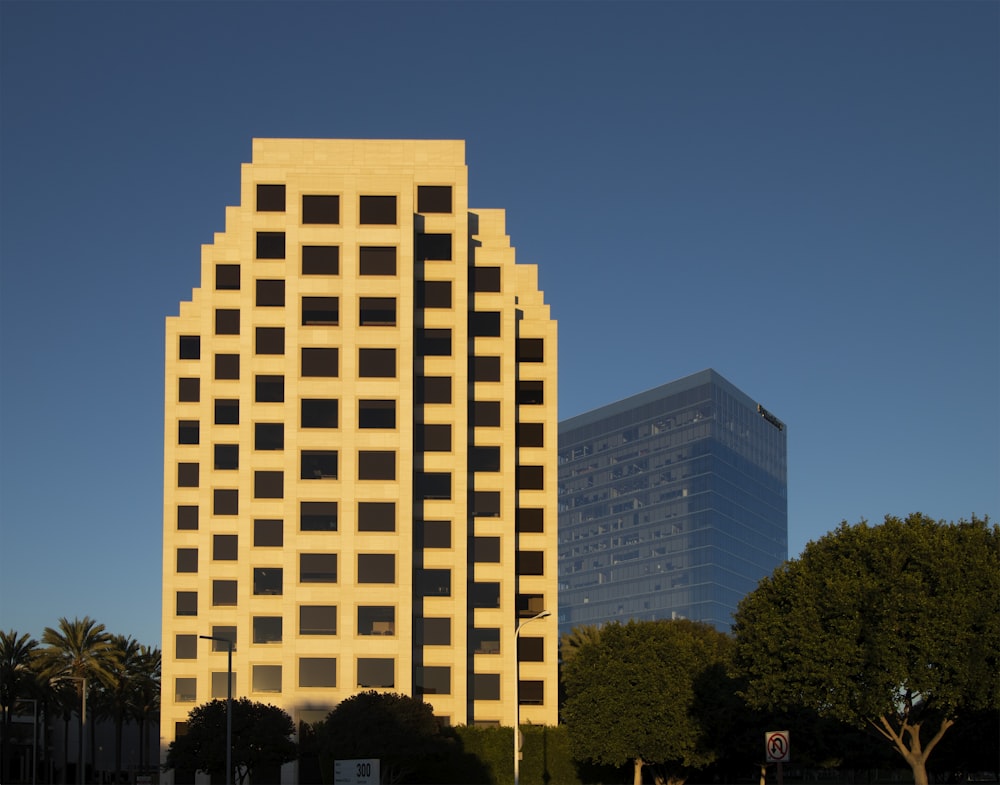 a tall building sitting next to a tall building