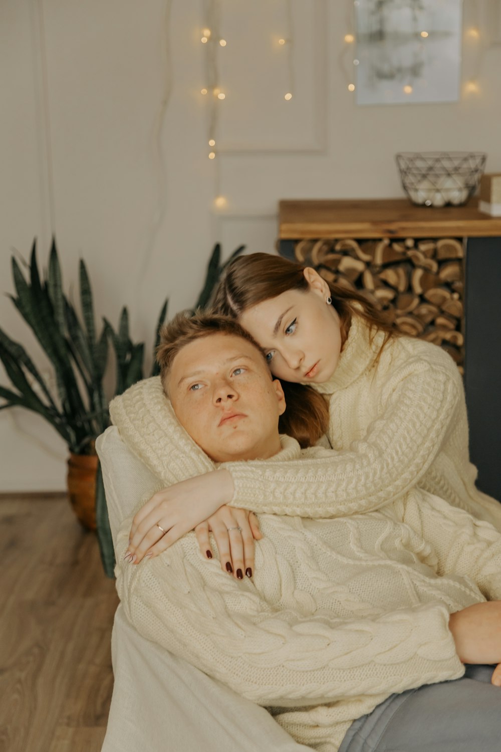 a man and a woman laying on a couch