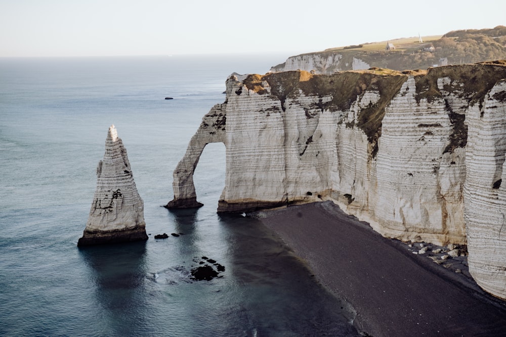 a large rock formation near a body of water