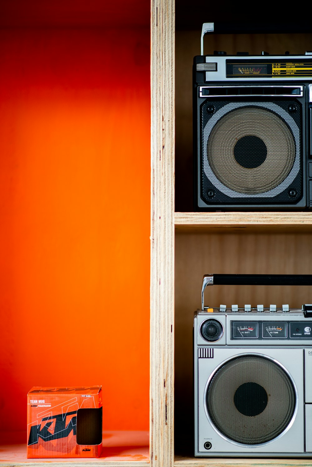 a radio and boom box on a shelf