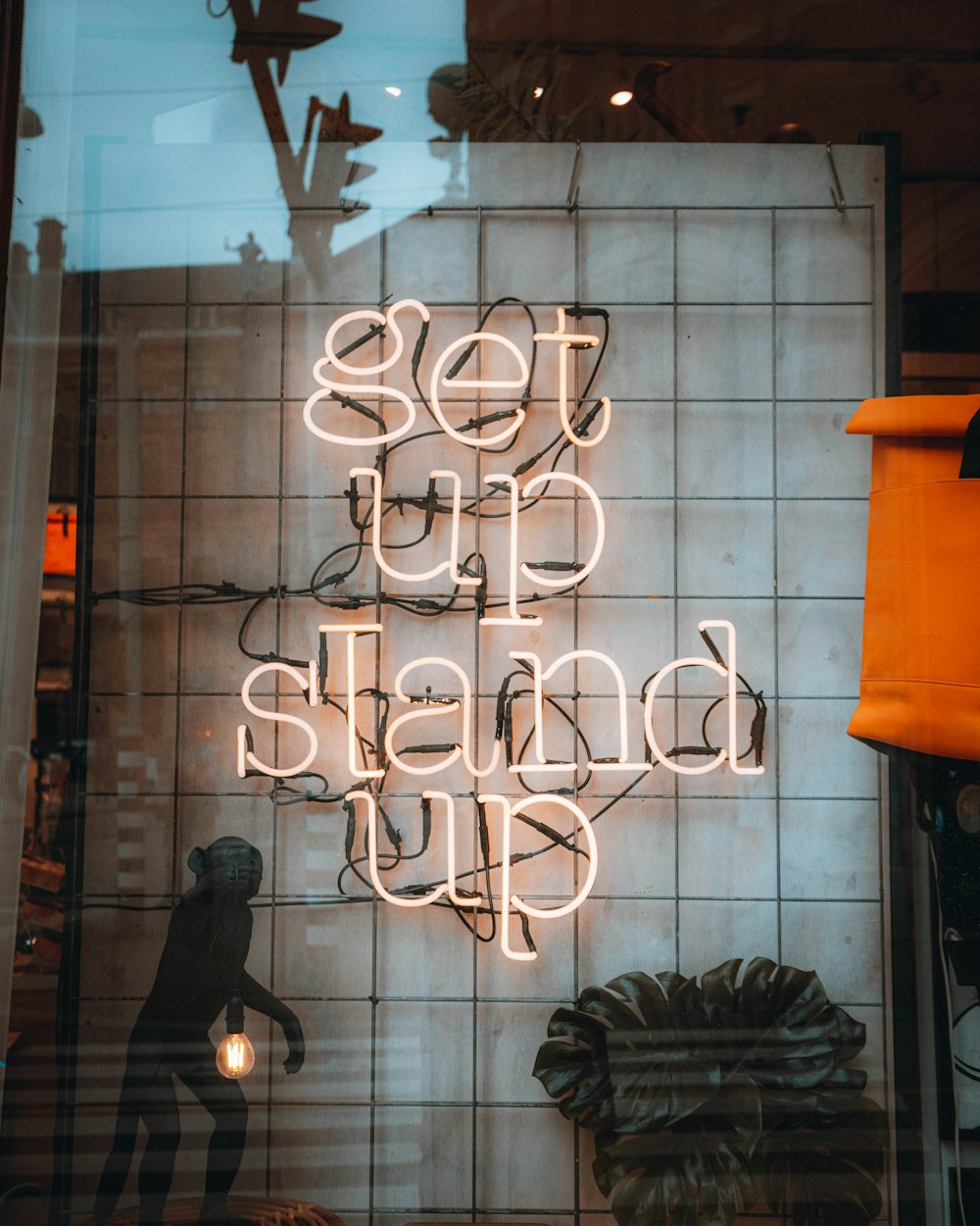 a neon sign that says set up a stand up