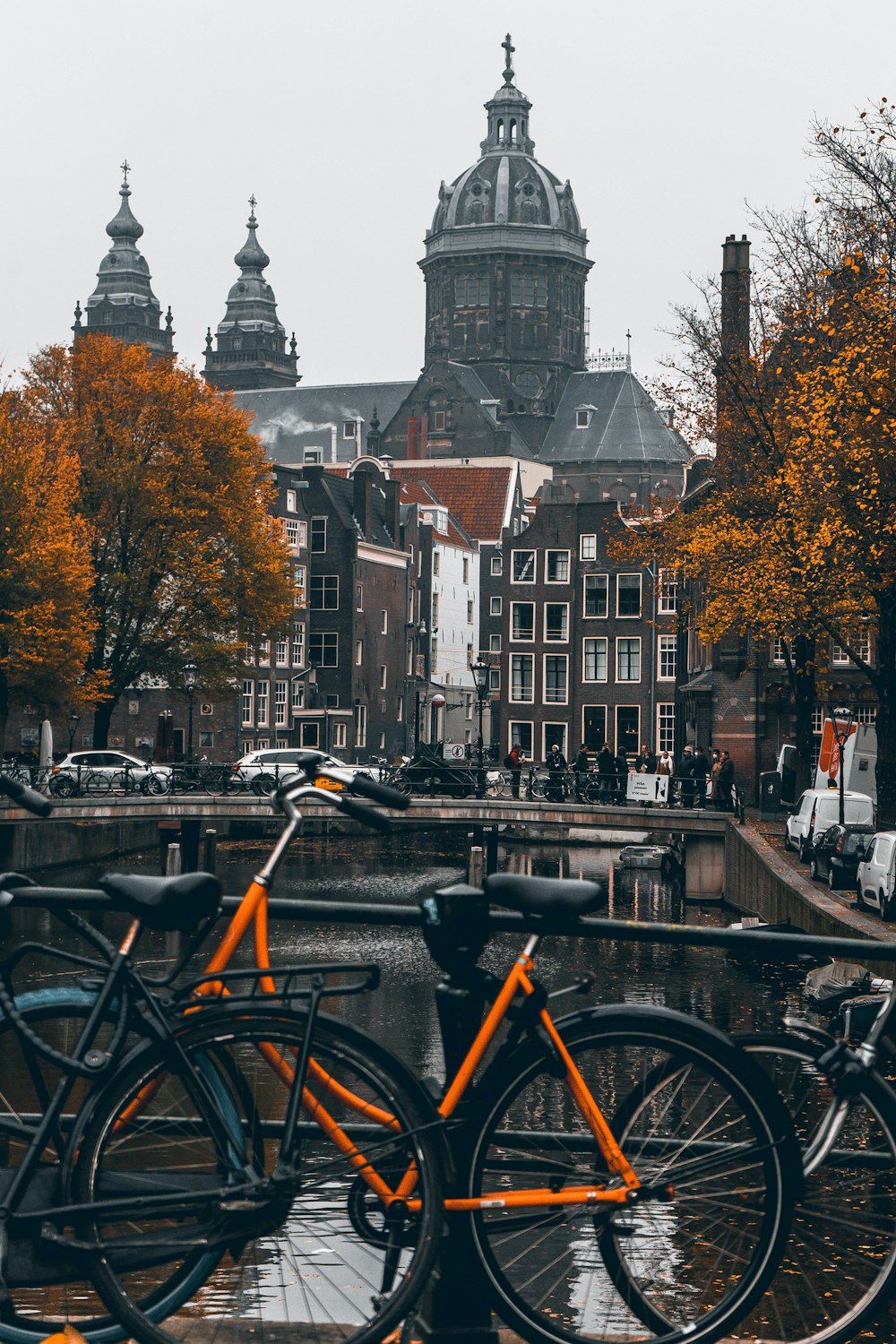 a couple of orange bikes parked next to each other