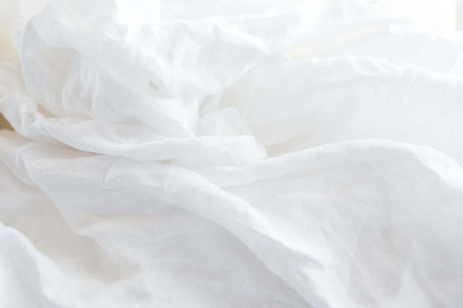 Crumpled white linen photographed very close