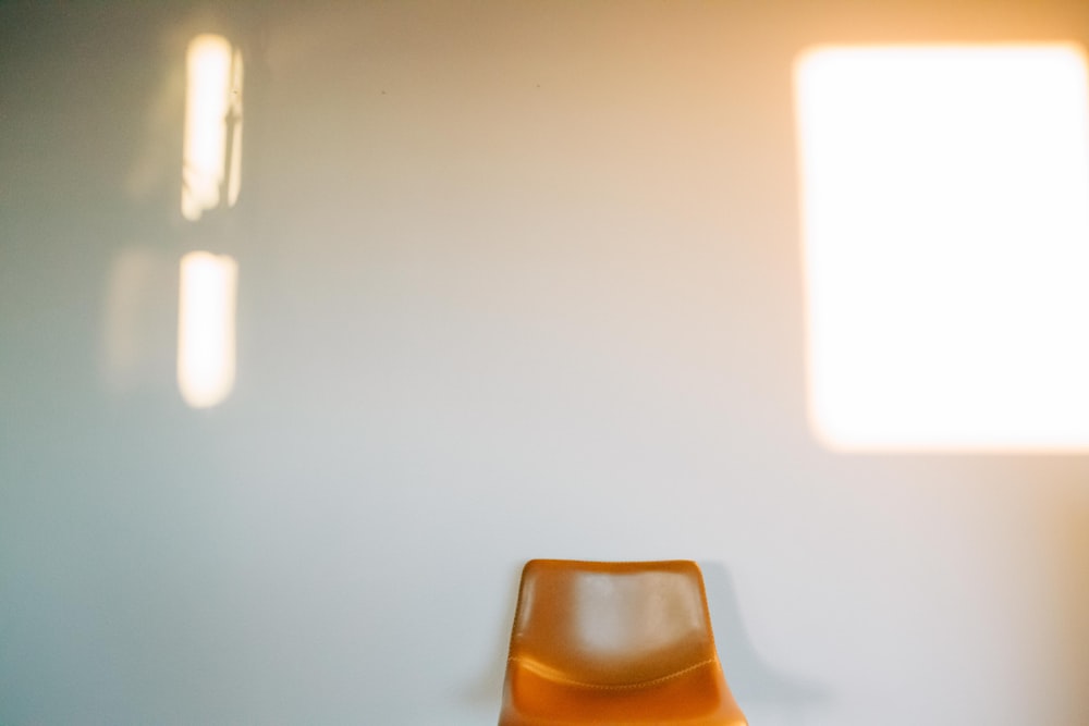 a chair sitting in a room next to a window