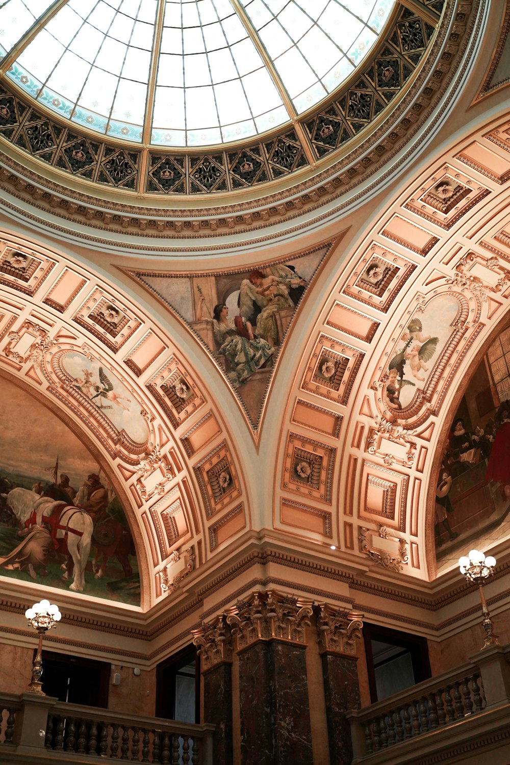 the ceiling of a building with paintings on it