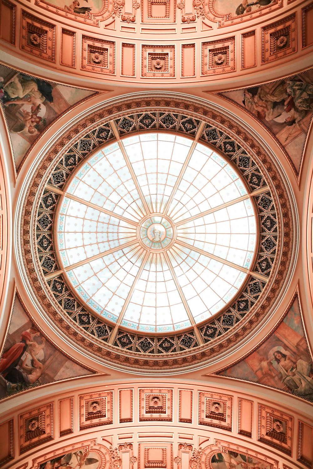 a domed ceiling in a building with paintings on it