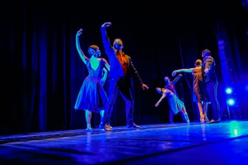 a group of people standing on top of a stage