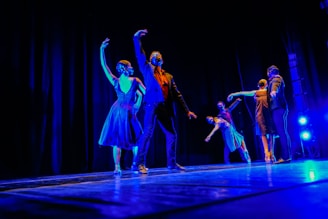a group of people standing on top of a stage