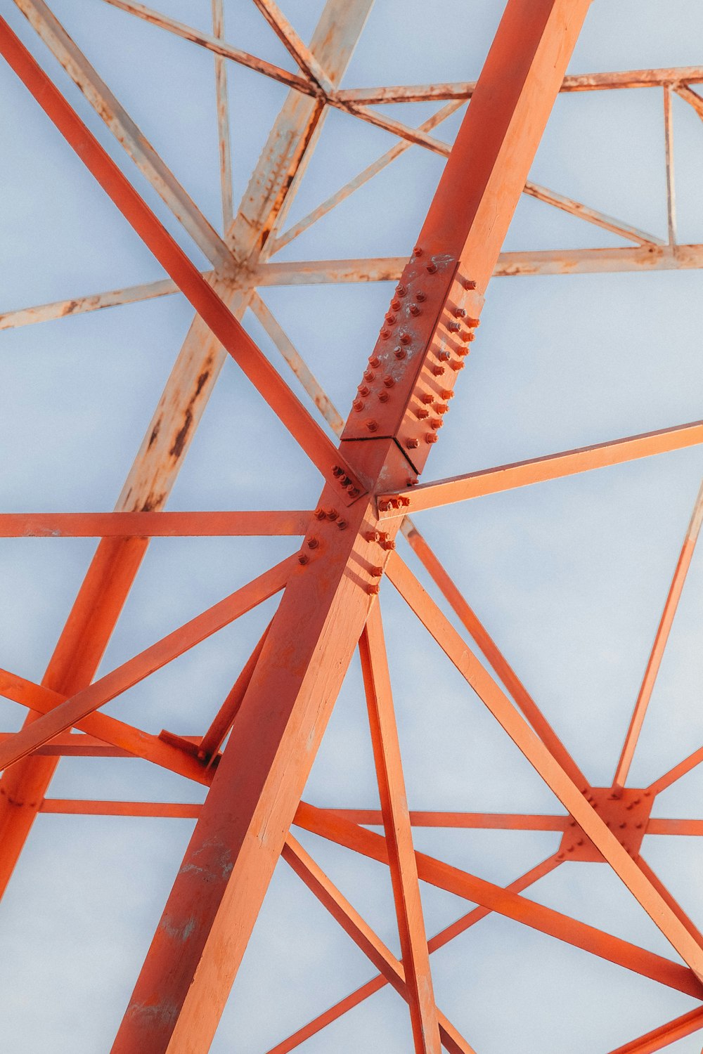 a close up of a metal structure against a blue sky