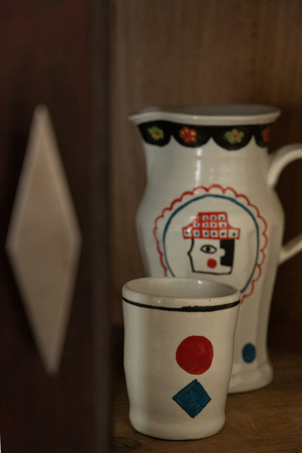 a close up of two cups on a shelf