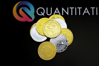 a pile of coins sitting on top of a black table