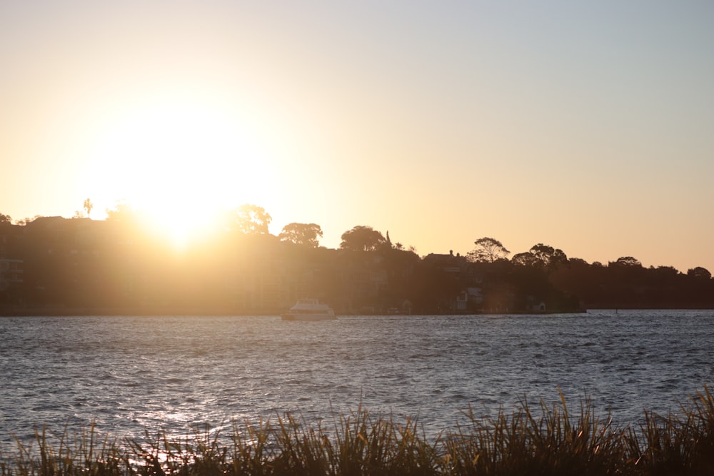 a body of water with a boat in the distance