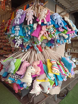 A colorful display of eco-friendly plush toys made from recycled materials.
