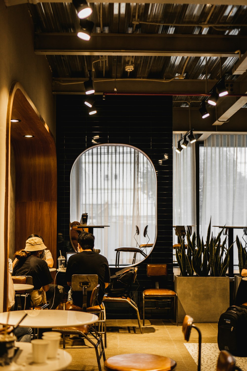 a man sitting at a table in a coffee shop