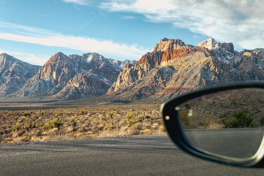 a pair of glasses sitting on the side of a road