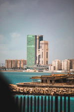 a large body of water next to a tall building