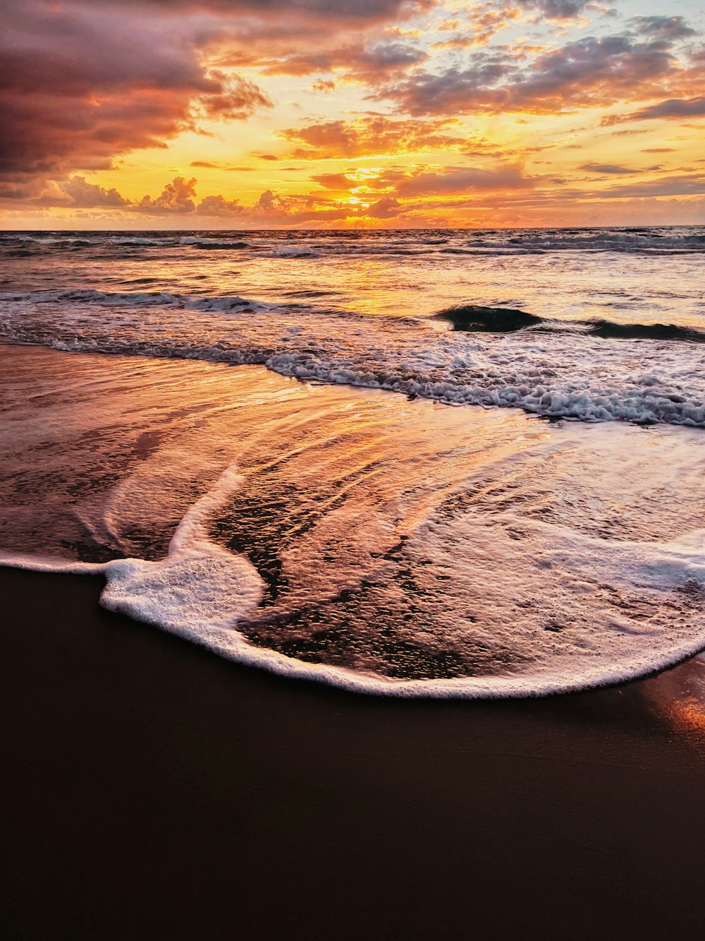 a sunset over a beach