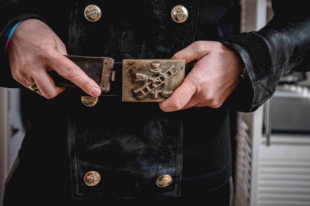 a close up of a person holding a metal object