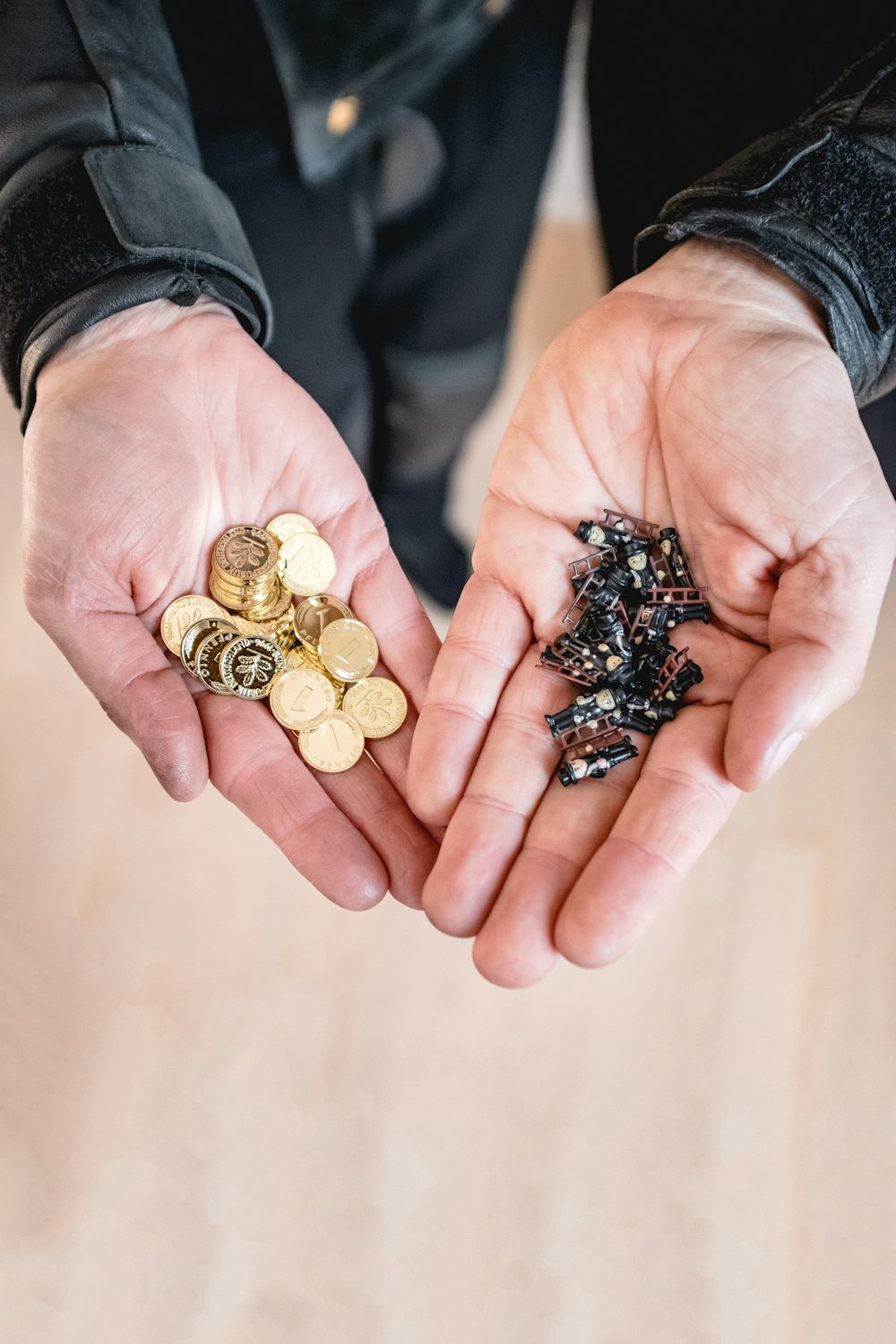 a person holding a handful of coins in their hands