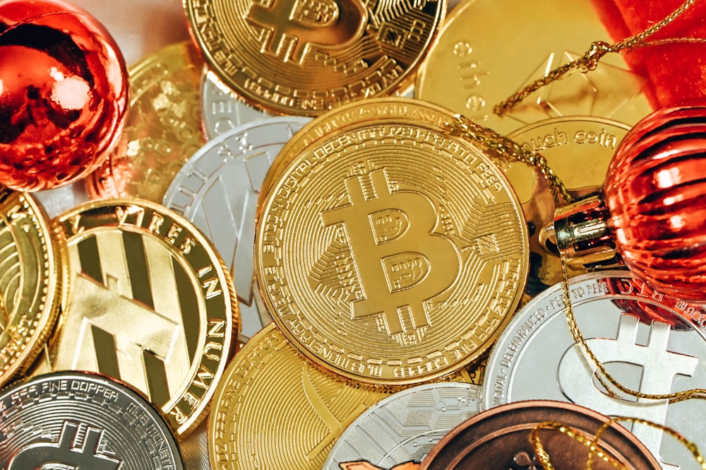 a pile of bitcoins and christmas ornaments