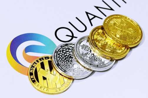 a pile of coins sitting on top of a white table