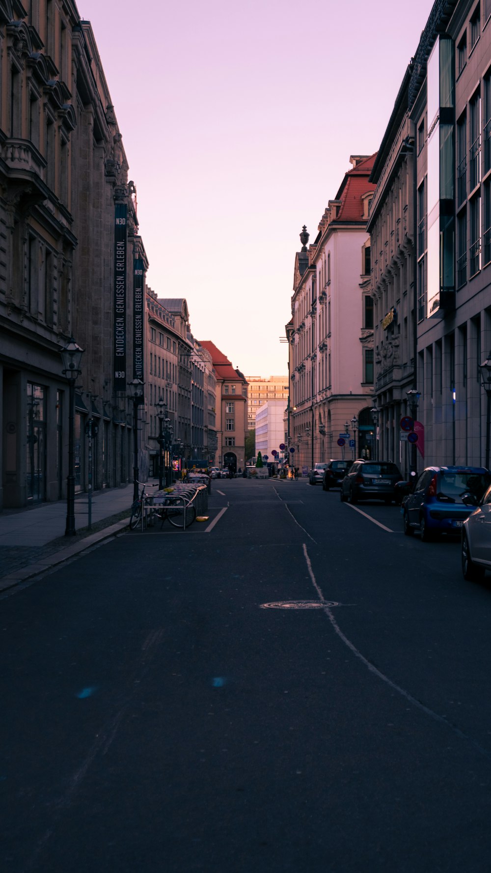 a street with cars parked on both sides of it