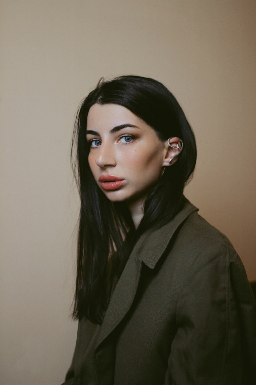 a woman with long black hair and blue eyes