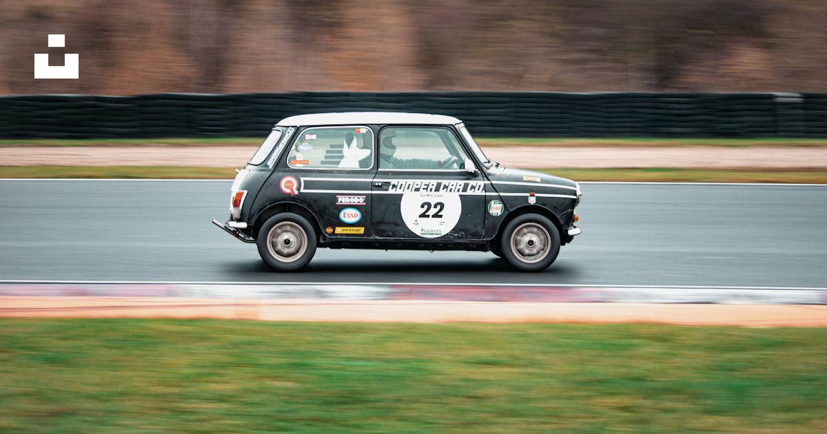 A small car driving down a race track photo – Free Car Image on Unsplash