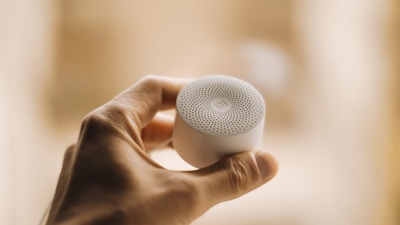 a person holding a white object in their hand