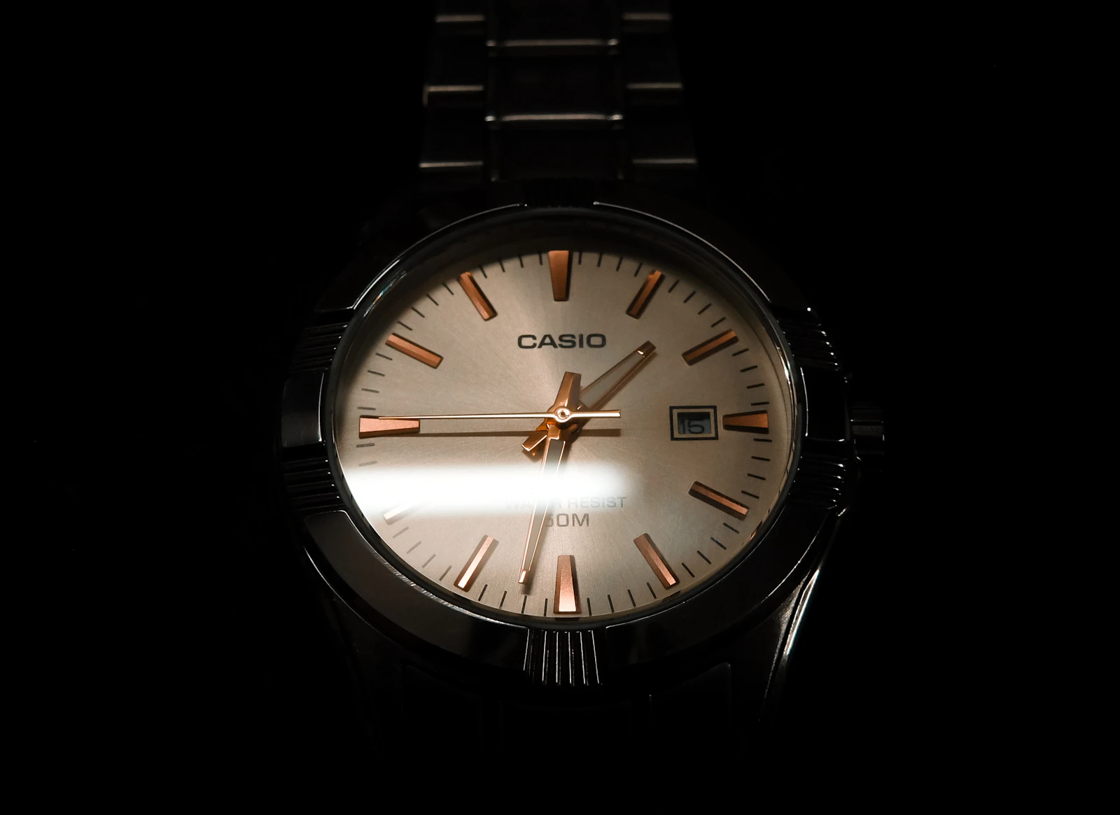 Watch at night with golden reflection