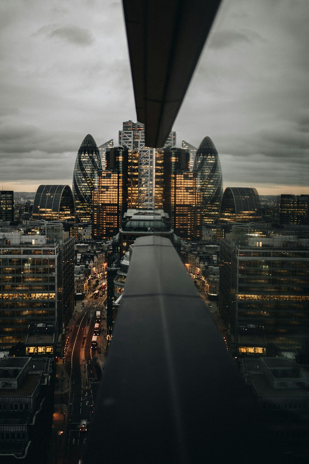 a view of a city at night from the top of a building