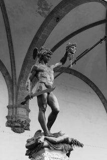 a black and white photo of a statue