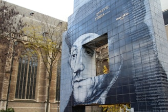 a large building with a mural of a man's face on it